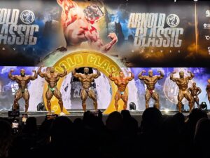 Arnold Classic 2025, bodybuilding competition, fitness event, Arnold Sports Festival, Derek Lunsford, Samson Dauda, Mitchell Hooper, Arnold Strongman Classic, Arnold Strongwoman Classic, Inez Carrasquillo, Ariel Khadr, Ashley Kaltwasser, Brandon Hendrickson, Terrence Ruffin, Isabelle Nunes, Harold Kelley, men's physique, classic physique, wellness division, strongman winners, strongwoman winners, fitness champions, powerlifting event, strength competition, bodybuilding results, Columbus Ohio, fitness industry, pro bodybuilding, sports performance, muscle building **Meta description:** Discover the winners of the 2025 Arnold Classic, featuring top athletes in bodybuilding, strongman, and fitness competitions.