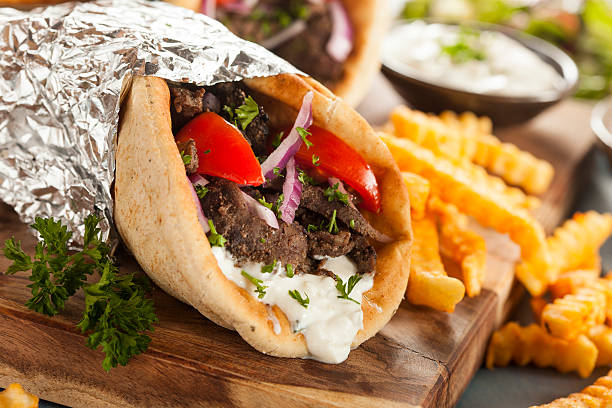 Greek gyro, lamb gyro, healthy gyro recipe, gyro history, Mediterranean diet, athlete meal, street food, Greek cuisine, protein-rich meals, nutritious lunch, fast recovery foods, post-workout meals, lamb recipe, Greek wrap, high-protein wrap, traditional gyro, easy gyro recipe, food for athletes, lamb health benefits, Mediterranean street food, healthy lamb recipe, pita wrap, gyro for muscle building, nutrient-dense meal, Greek yogurt sauce, Greek spices, meal prep ideas, international flavors, clean eating