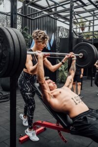 spotting, weightlifting, strength training, gym safety, bench press, squat, overhead press, lifting partner, resistance training, fitness tips